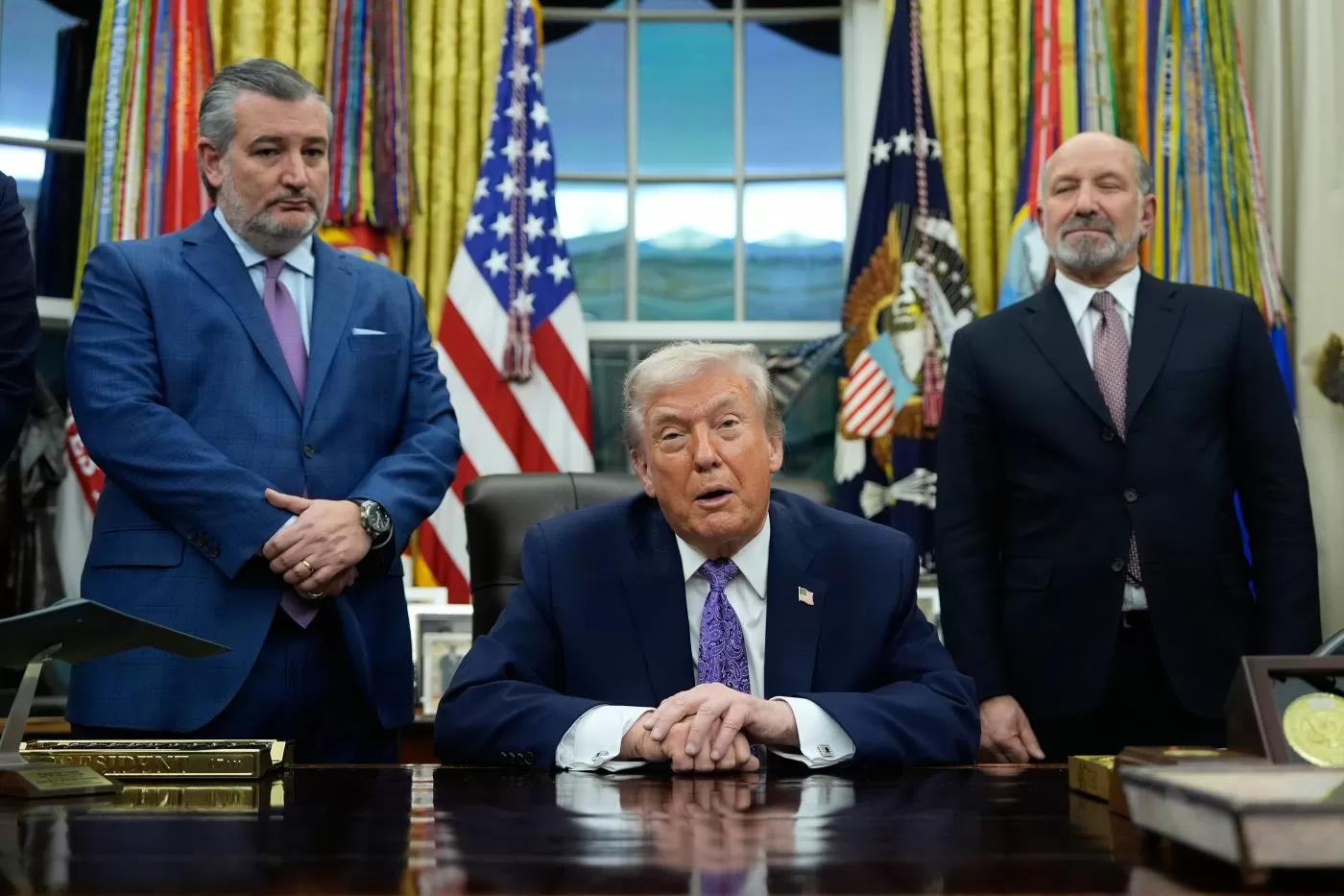 Trump signs order to fight state AI laws