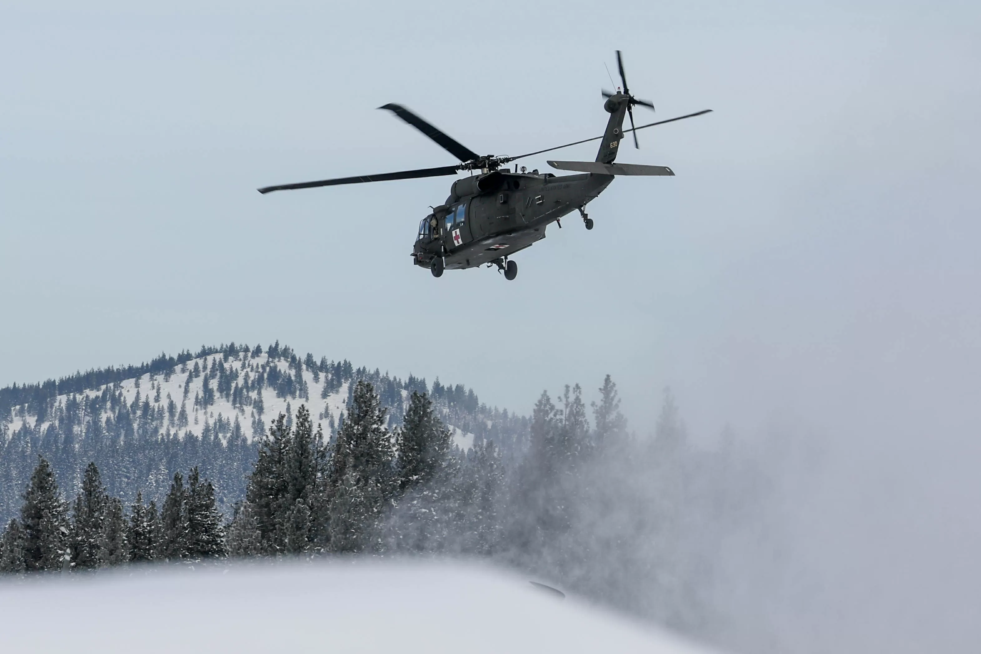 Avalanche risk lowered slightly as body recovery efforts of 8 skiers begins