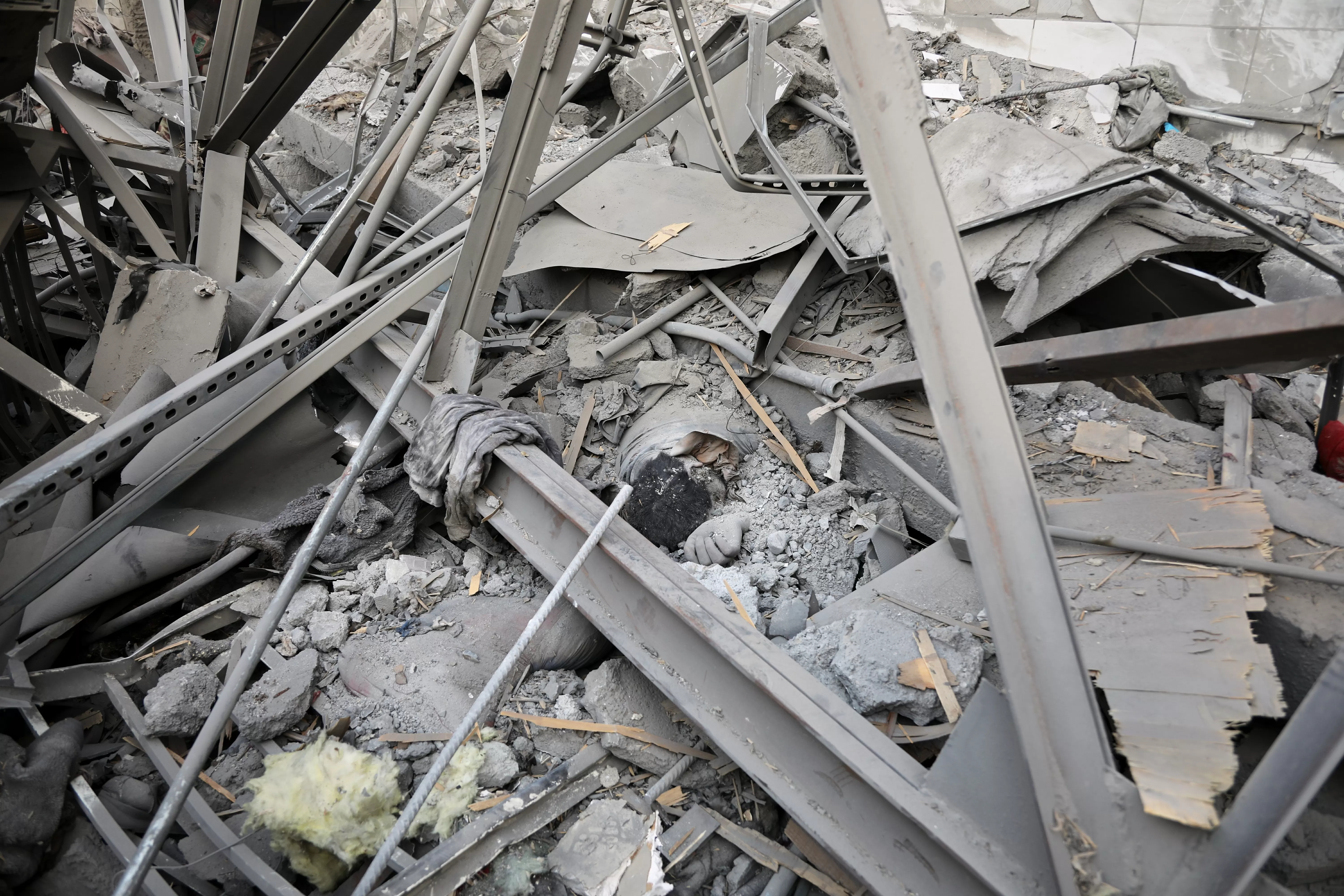 Rescue crews dig bodies out of the ruins of a Kabul hospital hit in an airstrike blamed on Pakistan