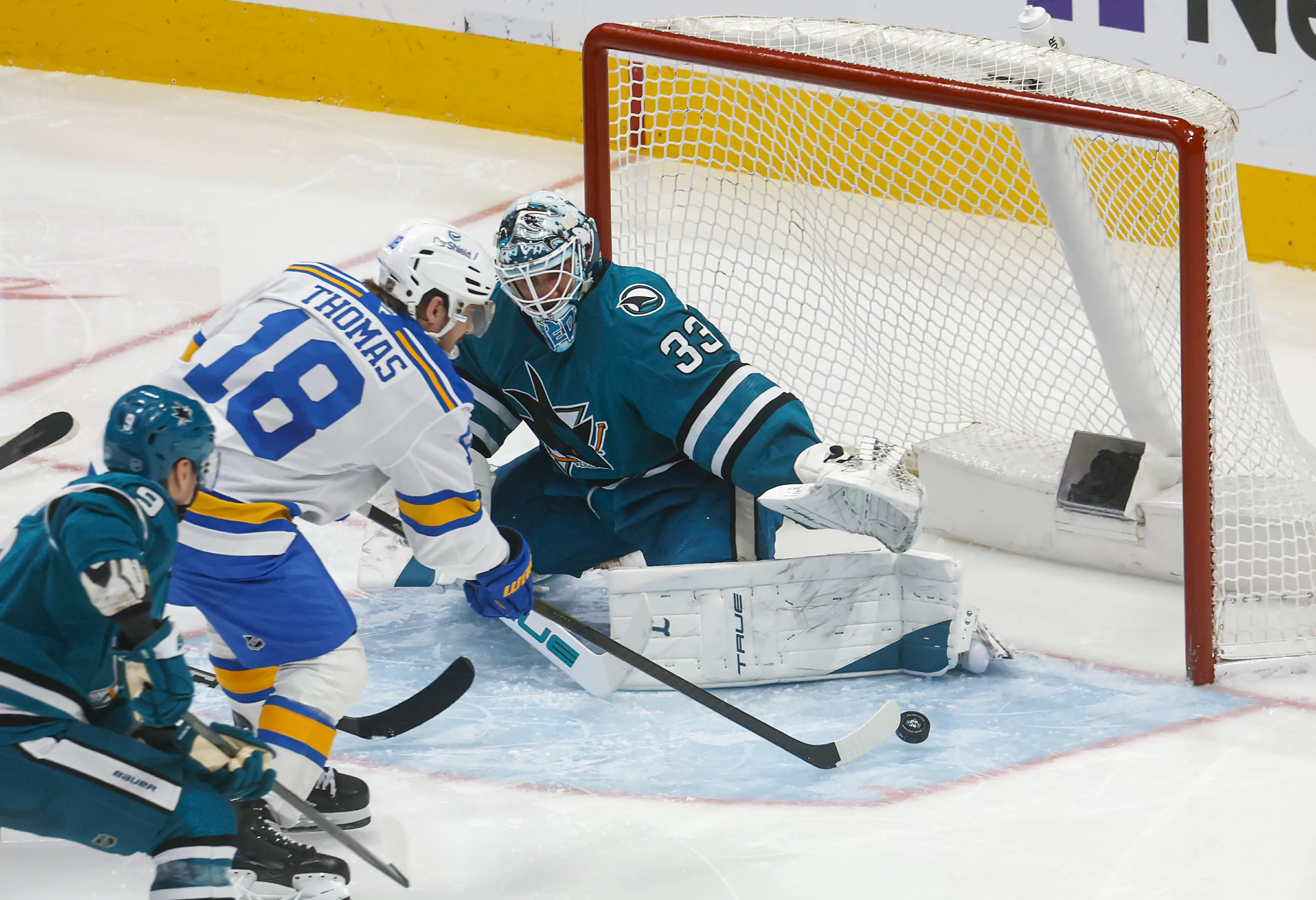 Sharks manage point in sloppy overtime loss to St. Louis Blues